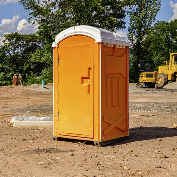 what is the cost difference between standard and deluxe portable restroom rentals in Adamsville